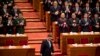 FILE - Chinese President Xi Jinping arrives for the closing session of the Chinese People's Political Consultative Conference (CPPCC) at the Great Hall of the People in Beijing, March 13, 2019.