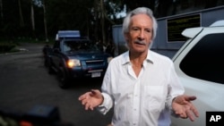 FILE - Guatemalan journalist Jose Ruben Zamora, founder of El Periodico newspaper, leaves a jail after a judge granted him house arrest, in Guatemala City, Oct. 19, 2024. 