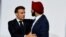 FILE - French President Emmanuel Macron speaks with World Bank President Ajay Banga as they take part in a round table to discuss the global economy during the New Global Financial Pact Summit at the Palais Brongniart in Paris, France on June 22, 2023.