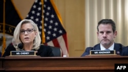 In this file photo taken on Dec. 1, 2021, Republican Representatives Liz Cheney, left, and Adam Kinzinger listen during a select committee investigating the Capitol attack.