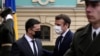 Ukrainian President Volodymyr Zelenskyy (L) welcomes French President Emmanuel Macron before a meeting on Feb. 8, 2022 in Kyiv, Ukraine. 