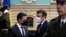 Ukrainian President Volodymyr Zelenskyy (L) welcomes French President Emmanuel Macron before a meeting on Feb. 8, 2022 in Kyiv, Ukraine. 