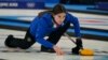 Stefania Constantini of Italy throws a last rock before a win against Norway during the mixed doubles gold medals curling match at the Beijing Winter Olympics, Feb. 8, 2022.