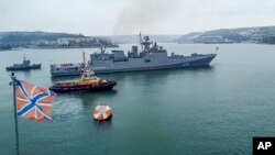 FILE - In this image from video released by the Russian Defense Ministry Press Service on Jan. 26, 2022, the Russian navy's frigate Admiral Essen prepares to sail off for an exercise in the Black Sea.