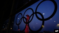 The Beijing Olympic Tower is displayed inside the Olympic rings at the main media center, Jan. 31, 2022.