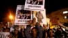 African migrants and Israeli activists demonstrate against the Israeli government's plan to deport African migrants, in Jerusalem, April 4, 2018.