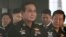 Thailand's Army commander Gen. Prayuth Chan-ocha, left, arrives at the Royal Thai Army Club in Bangkok, Thailand, June 13, 2014. 