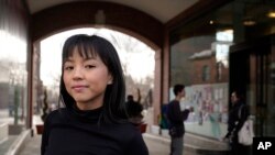 Brown University student Zoe Fuad, of Spring, Texas, stands for a photograph on the Brown campus, in Providence, R.I., Feb. 10, 2022.