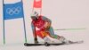 Shannon-Ogbnai Abeda of Eritrea passes a gate during the second run of the men's giant slalom at the 2022 Winter Olympics, Feb. 13, 2022, in the Yanqing district of Beijing.