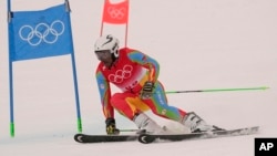 Shannon-Ogbnai Abeda of Eritrea passes a gate during the second run of the men's giant slalom at the 2022 Winter Olympics, Feb. 13, 2022, in the Yanqing district of Beijing.