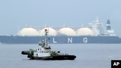 利比里亞液化天然氣油輪Al Hamra 抵達東京西南部橫濱的一個港口。(2014 年4 月21 日)