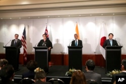 Menteri Luar Negeri AS Antony Blinken, Menteri Luar Negeri Australia Marise Payne, Menteri Luar Negeri India S. Jaishankar, dan Menteri Luar Negeri Jepang Yoshimasa Hayashi dalam konferensi pers di Melbourne. (Foto: via AP)