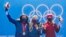 From left, Elana Meyers Taylor, of the United States, Kaillie Humphries, of the United States, and Christine De Bruin, of Canada, pose at the podium for the women's monobob at the 2022 Winter Olympics, Feb. 14, 2022.
