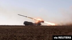 A Russian "Uragan" self-propelled multiple rocket launcher system launches a rocket during military exercises in Crimea, in this still image taken from a handout video released Feb. 15, 2022.