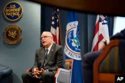FILE - US Customs and Border Protection Commissioner Chris Magnus speaks during an interview in his office with The Associated Press, Feb. 8, 2022, in Washington.