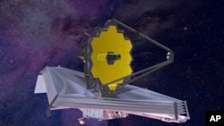 FILE - This artist's rendering of the James Webb Space Telescope shows its 21-foot, gold-coated primary mirror fully deployed. (NASA via AP)