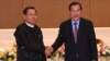 FILE - Cambodian Prime Minister Hun Sen, right, shakes hands with Myanmar State Administration Council Chairman, Senior General Min Aung Hlaing, left, during after a meeting in Naypyitaw, Myanmar, Jan. 7, 2022. 