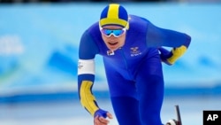 Nils van der Poel of Sweden competes in the men's speedskating 10,000-meter race at the 2022 Winter Olympics, Feb. 11, 2022, in Beijing.