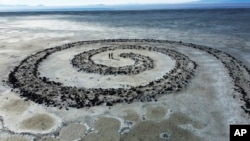 The Great Salt Lake is seen behind the earthwork Spiral Jetty by Robert Smithson on Tuesday, Feb. 1, 2022, on the northeastern shore of the Great Salt Lake near Rozel Point in Utah.(AP Photo/Rick Bowmer)