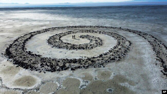 The Great Salt Lake is seen behind the earthwork Spiral Jetty by Robert Smithson on Tuesday, Feb. 1, 2022, on the northeastern shore of the Great Salt Lake near Rozel Point in Utah.(AP Photo/Rick Bowmer)