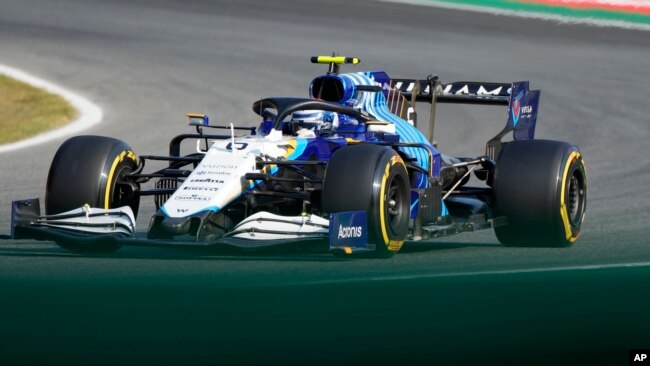 FILE - Williams driver Nicholas Latifi of Canada steers his car during the Sprint Race qualifying session at the Monza racetrack, in Monza, Italy , Saturday, Sept.11, 2021. The Formula one race will be held on Sunday. (AP Photo/Luca Bruno)