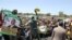 Zimbabwe's ruling ZANU-PF supporters at a rally on Feb. 12, 2022 in Epworth about 40 minutes south east of Harare. (Columbus Mavhunga/VOA)