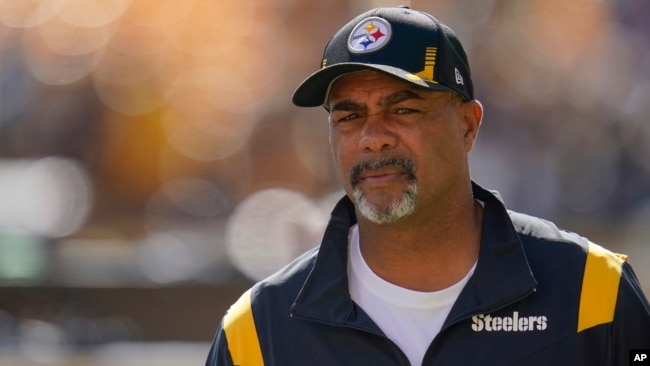 FILE - Pittsburgh Steelers assistant coach Teryl Austin watches the team warm up before an NFL football game against the Cincinnati Bengals, Sept. 26, 2021, in Pittsburgh.