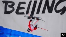 China's He Binghan competes during the men's halfpipe qualification at the 2022 Winter Olympics, Feb. 17, 2022, in Zhangjiakou, China. 