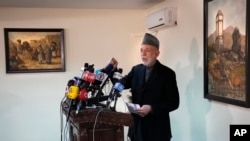 FILE - Afghanistan's former President Hamid Karzai, speaks during a press conference, in Kabul, Afghanistan, Feb. 13, 2022.