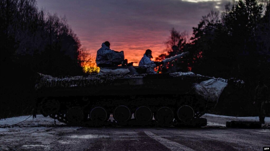 This handout picture from the press-service of General Staff of the Armed Forces of Ukraine shows Ukrainian servicemen making 200-kilometer day-night-day march as part of combat training in Chernihiv region on Feb. 12, 2022. 