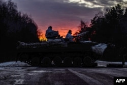 This handout picture from the press-service of General Staff of the Armed Forces of Ukraine shows Ukrainian servicemen making 200-kilometer day-night-day march as part of combat training in Chernihiv region, Feb. 12, 2022.