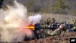 A Ukrainian serviceman fires an NLAW anti-tank weapon during an exercise in the Joint Forces Operation, in the Donetsk region, eastern Ukraine, Feb. 15, 2022. 