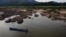 FILE - This aerial photo taken on Oct. 31, 2019, shows a fisherman on a boat on the drought-stricken Mekong river in Pak Chom district in the northeastern Thai province of Loei.