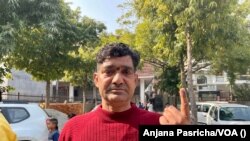 Kesh Ram Awana, a BJP supporter, says he is happy that a temple is being constructed to honor Hindu god Rama in Ayodhya town in the state, Feb. 10, 2022.