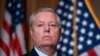 Sen. Lindsey Graham, R-S.C., waits to speak to reporters following bipartisan passage of the Ending Forced Arbitration of Sexual Assault and Sexual Harassment Act, at the Capitol in Washington, Feb. 10, 2022.