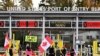 A convoy of truckers and supporters continue to protest COVID-19 vaccine mandates at a closed border on Pacific highway, near the border in Surrey, British Columbia, Canada, Feb. 12, 2022. 