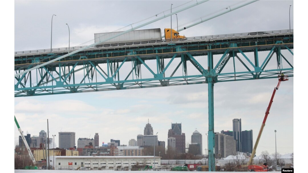 A commercial truck crosses the Ambassador Bridge to Canada from Detroit, Michigan, Feb. 14, 2022.