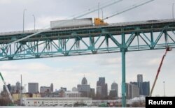 A commercial truck crosses the Ambassador Bridge to Canada from Detroit, Michigan, Feb. 14, 2022.