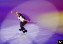 FILE - Elladj Balde of Canada performs during the gale exhibition of the NHK Trophy figure skating in Osaka, western Japan, Nov. 30, 2014.