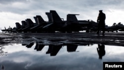 F/A-18E and 18F Super Hornets are seen on the flight deck of the Nimitz-class aircraft carrier USS Harry S. Truman (CVN 75) in the Adriatic Sea, off Split, Croatia, Feb. 14, 2022.