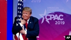 Trump hugs flag