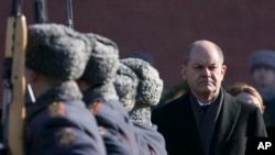 German Chancellor Olaf Scholz, attends a wreath-laying ceremony at the Tomb of the Unknown Soldier at the Kremlin Wall in Moscow, Russia, Feb. 15, 2022.