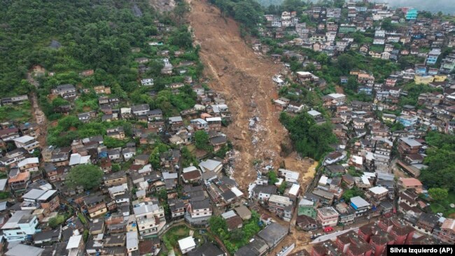 An aerial view shows a neighborhood affected by landslides in Petropolis, Brazil, Wednesday, Feb. 16, 2022. 