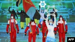 Eritrea's flag bearer, Shannon-Ogbnai Abeda, leads the delegation during the opening ceremony of the Beijing 2022 Winter Olympic Games, in Beijing, on Feb. 4, 2022.