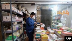 A member of staff prepares publications for transfer to bookshops, at Iran's Houpa publishing house in Tehran, on Jan. 29, 2022.