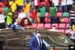 FILE - Cameroon's President Paul Biya and his wife Chantal Biya arrive for the African Cup of Nations 2022 group A soccer match between Ethiopia and Cape Verde at the Olembe stadium in Yaounde, Cameroon, Jan. 9, 2022.