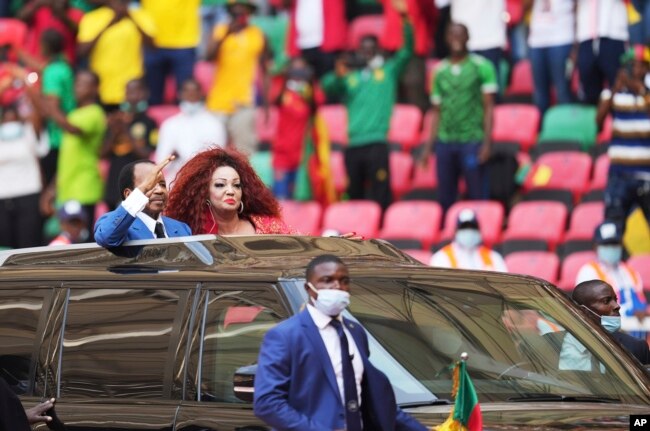 FILE - Cameroon's President Paul Biya and his wife Chantal Biya arrive for the African Cup of Nations 2022 group A soccer match between Ethiopia and Cape Verde at the Olembe stadium in Yaounde, Cameroon, Jan. 9, 2022.