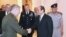 FILE - A handout picture released by the Egyptian Presidency June 11, 2019, shows Egyptian President Abdel Fattah el-Sissi (C-R) shaking hands with the head of U.S. Central Command, Marine Corps General Kenneth F. McKenzie Jr., at the presidential palace