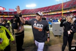 Cincinnati Bengals quarterback Joe Burrow waves to fans as he walks off the field. (AP Photo/Paul Sancya)