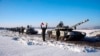 In this photo taken from video and provided by the Russian Defense Ministry Press Service Feb. 15, 2022, Russian army tanks stand in formation after drills in Russia. 